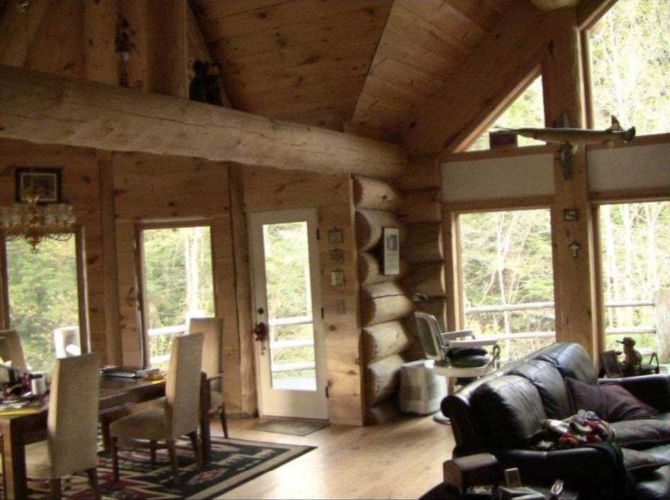Finished log home great room with large windows