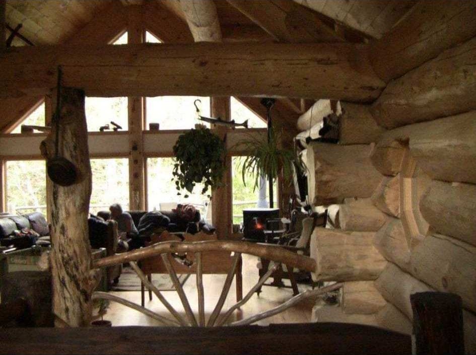 Custom log railing inside a handcrafted home